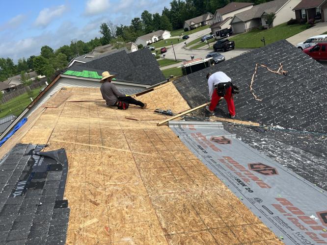 Workers repair Sellersburg roof after storm damage