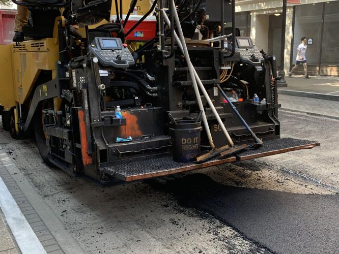 Louisville Metro Public Works crews pave a downtown Louisville road on July 26, 2023