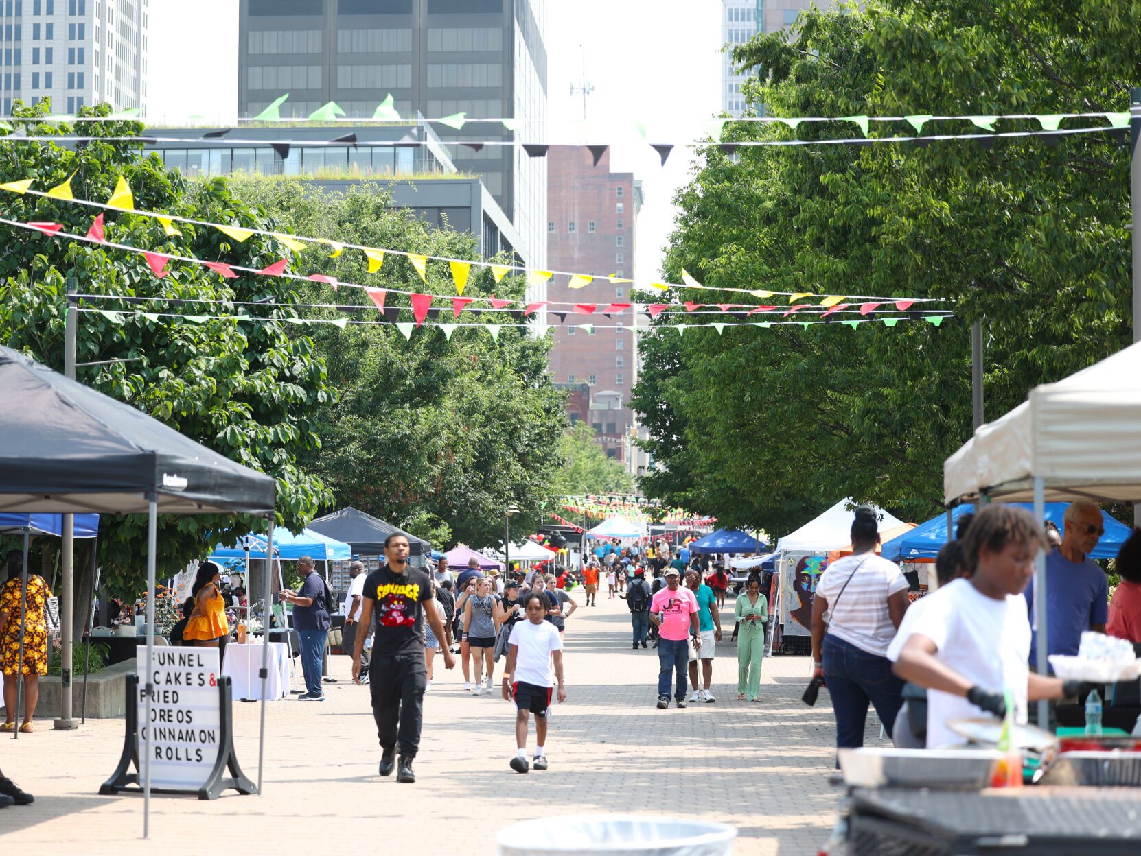 Crowd moves around at Juneteenth Festival.JPG
