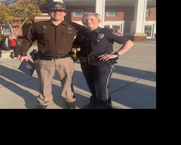 Brandon Shirley with officer cropped.jpg