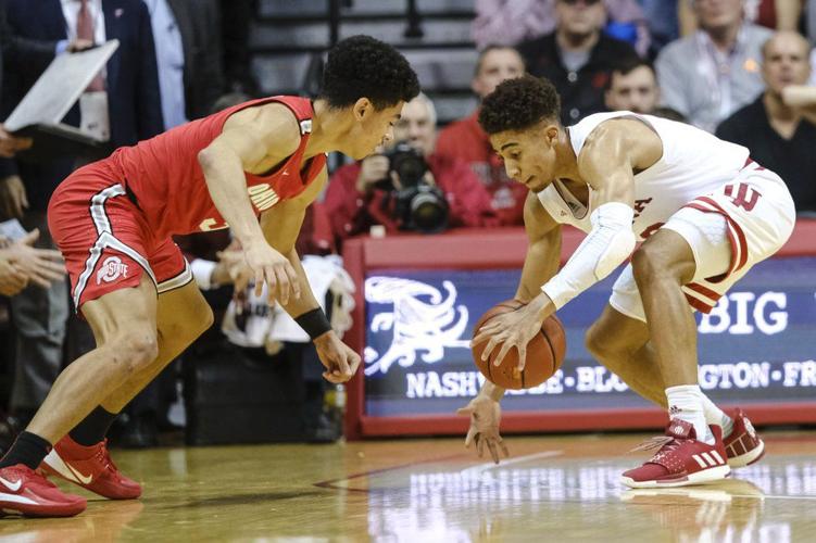 Indiana guard Rob Phinisee, right, steals the ball from Ohio State guard D.J. Carton