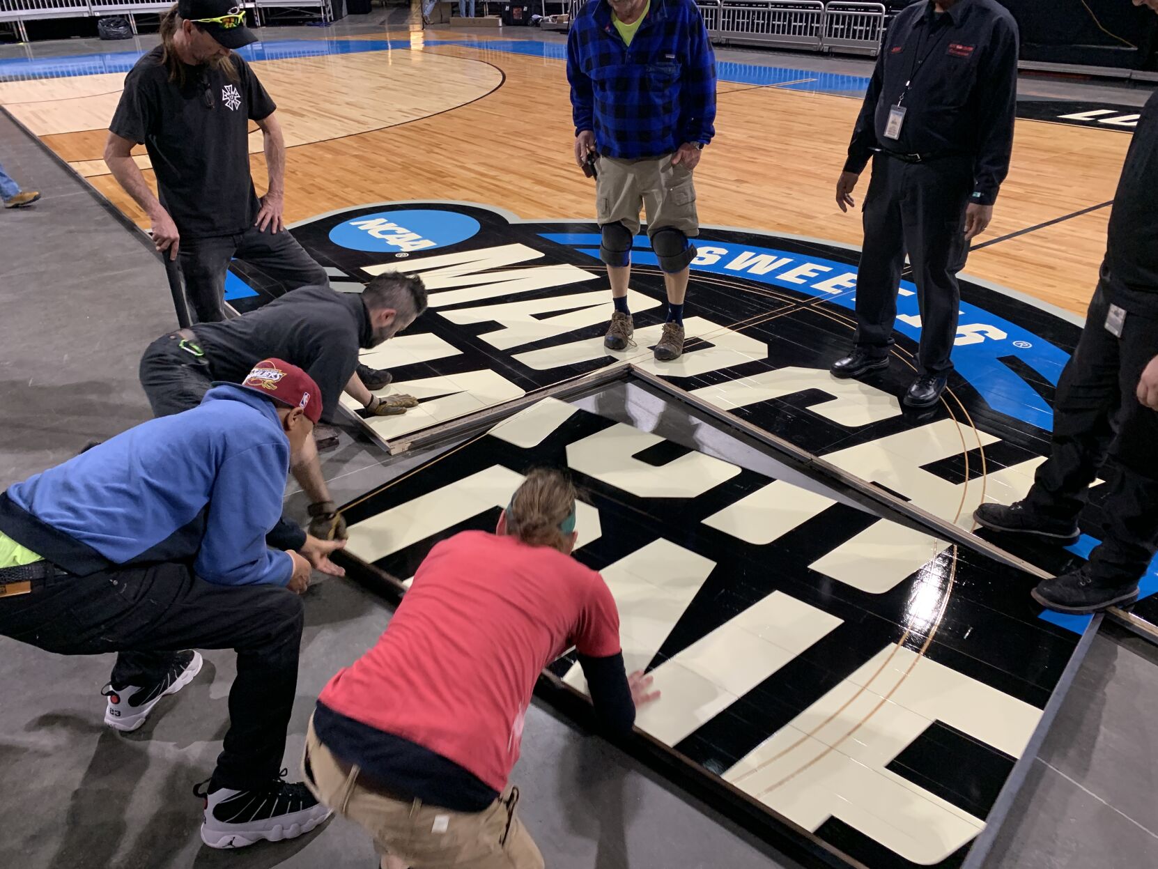NCAA FLOOR  BEING INSTALLED AT YUM CENTER 3-21-2023 (10).JPG