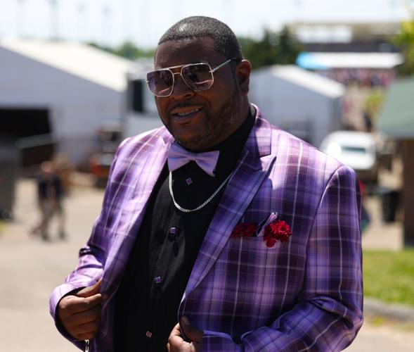Man shows off bowtie in infield.JPG