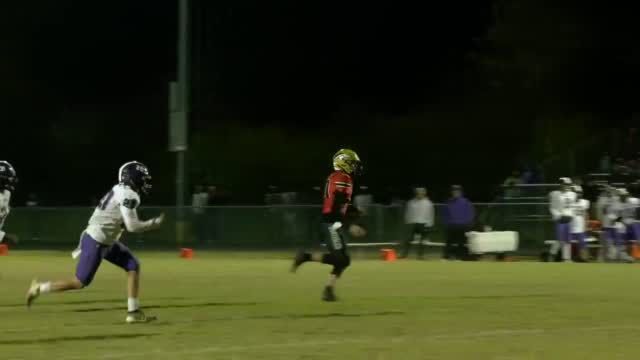 Travis Egan runs out of the pocket.jpg