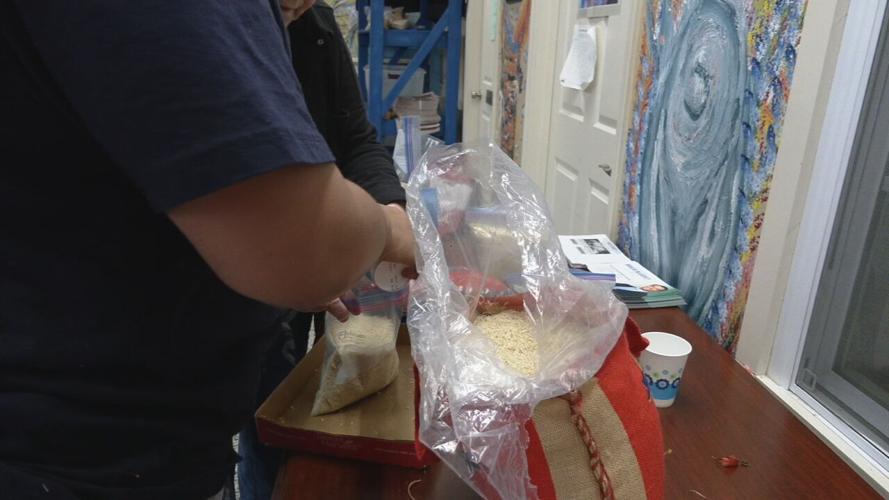 Volunteers assemble food bags, hygiene kits at La Casita Center 4-7-23