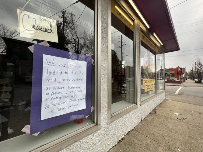 Sign informs customers of Garden Girl Foods relocation