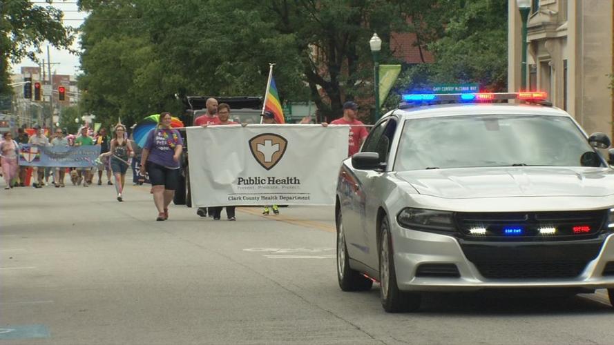 People walk in Southern Indiana Pride Parade