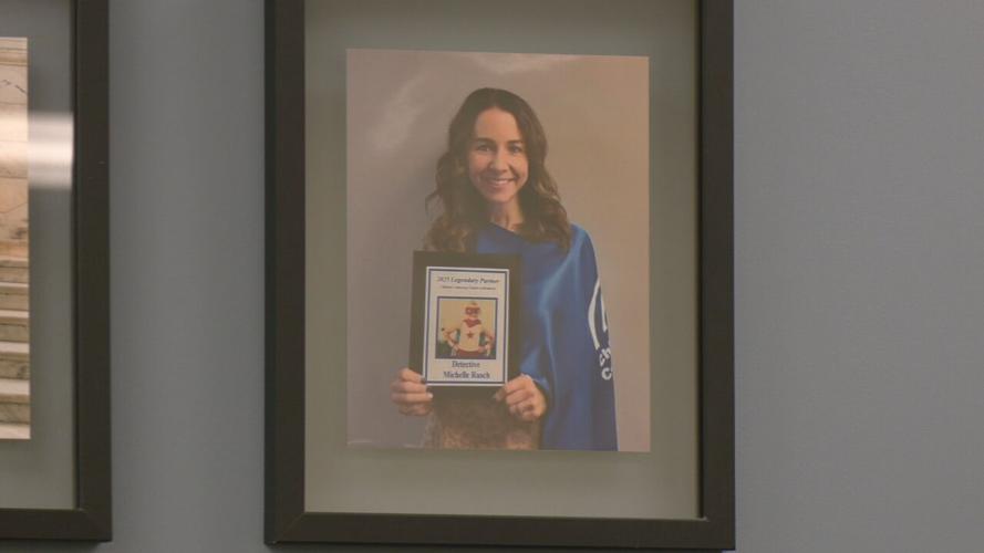 Portrait of LMPD Detective Michele Rusch holding award