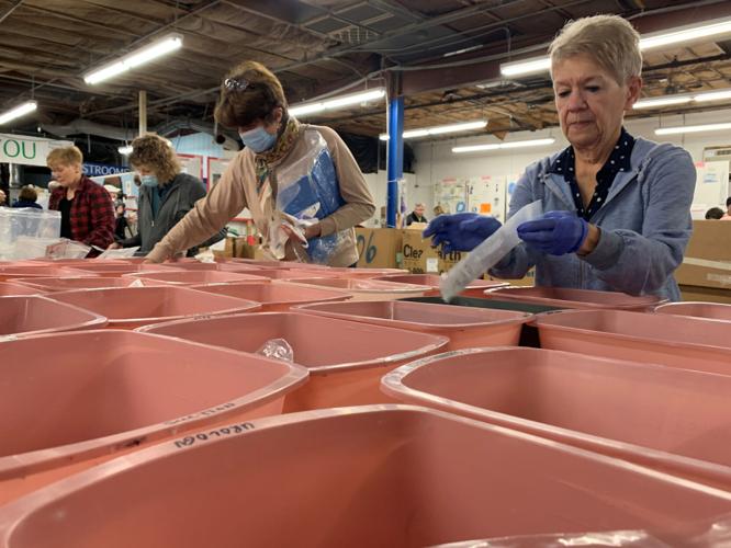 Volunteers at Louisville-based SOS assemble medical kits bound for Ukraine