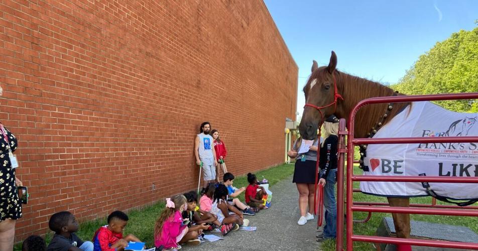 Hank the Horse visits students in Lexington