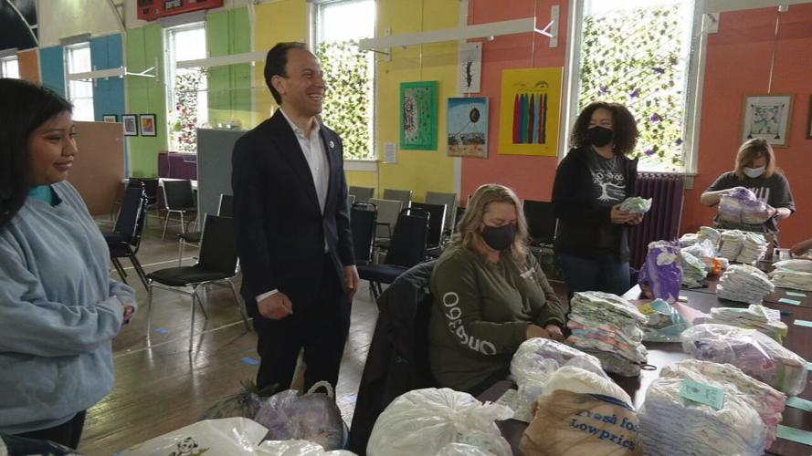 Volunteers assemble food bags, hygiene kits at La Casita Center 4-7-23