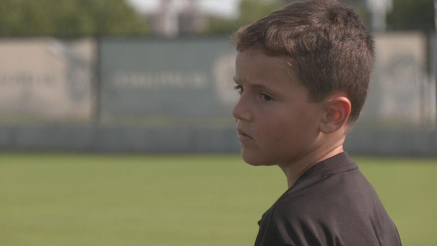 Drew looks on at Lou City's practice