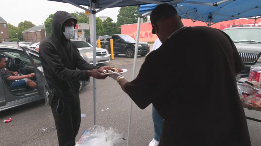 Members of One Nation Riders pass out food to residents of Louisville