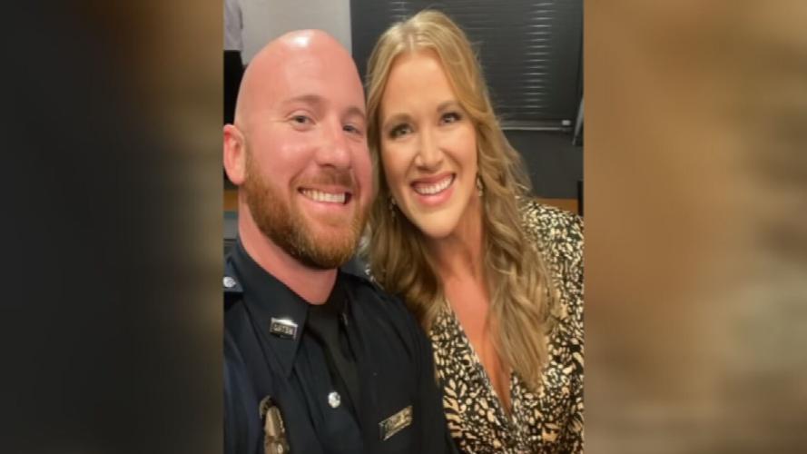 LMPD Officer Travis Tracy with his wife