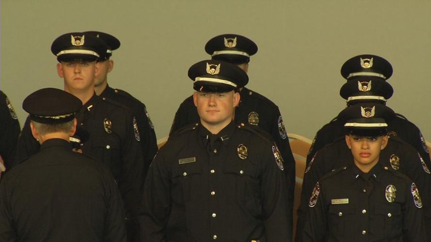 Members of LMPD's last graduating class of 2019 stand