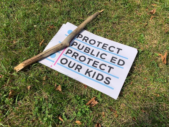 Sign at JCPS board meeting