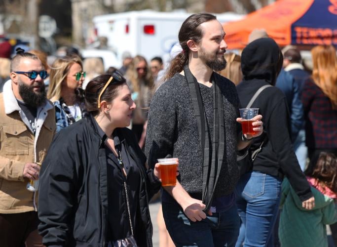 Two people carry a beer at Bock Fest.JPG