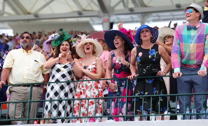 People cheer at First Stretch during Kentucky Derby.JPG