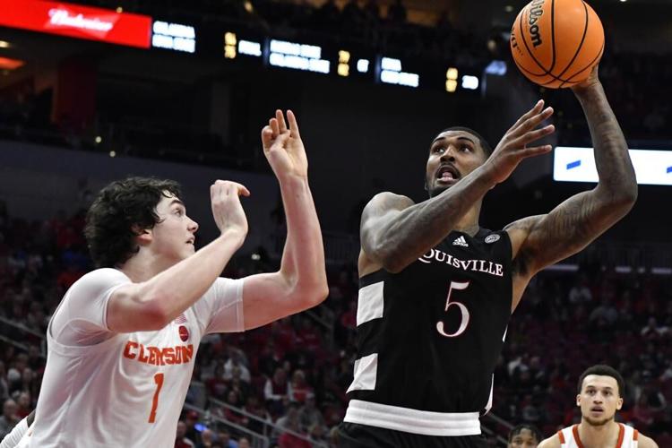 Louisville forward Malik Williams attempts a shot over Clemson forward Ian Schieffelin.jpeg