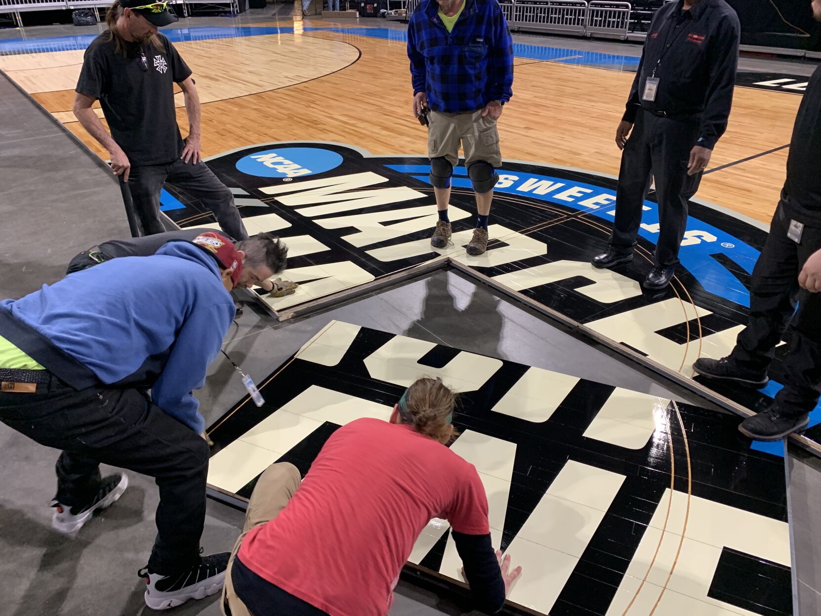 NCAA FLOOR  BEING INSTALLED AT YUM CENTER 3-21-2023 (9).JPG