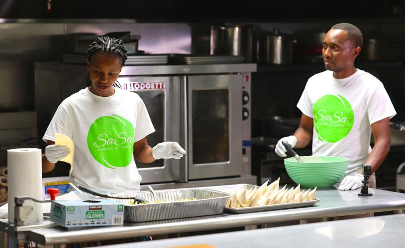 Sarah and Joseph Kimeu prepare food at Sasa Samosa Kitchen.jpg