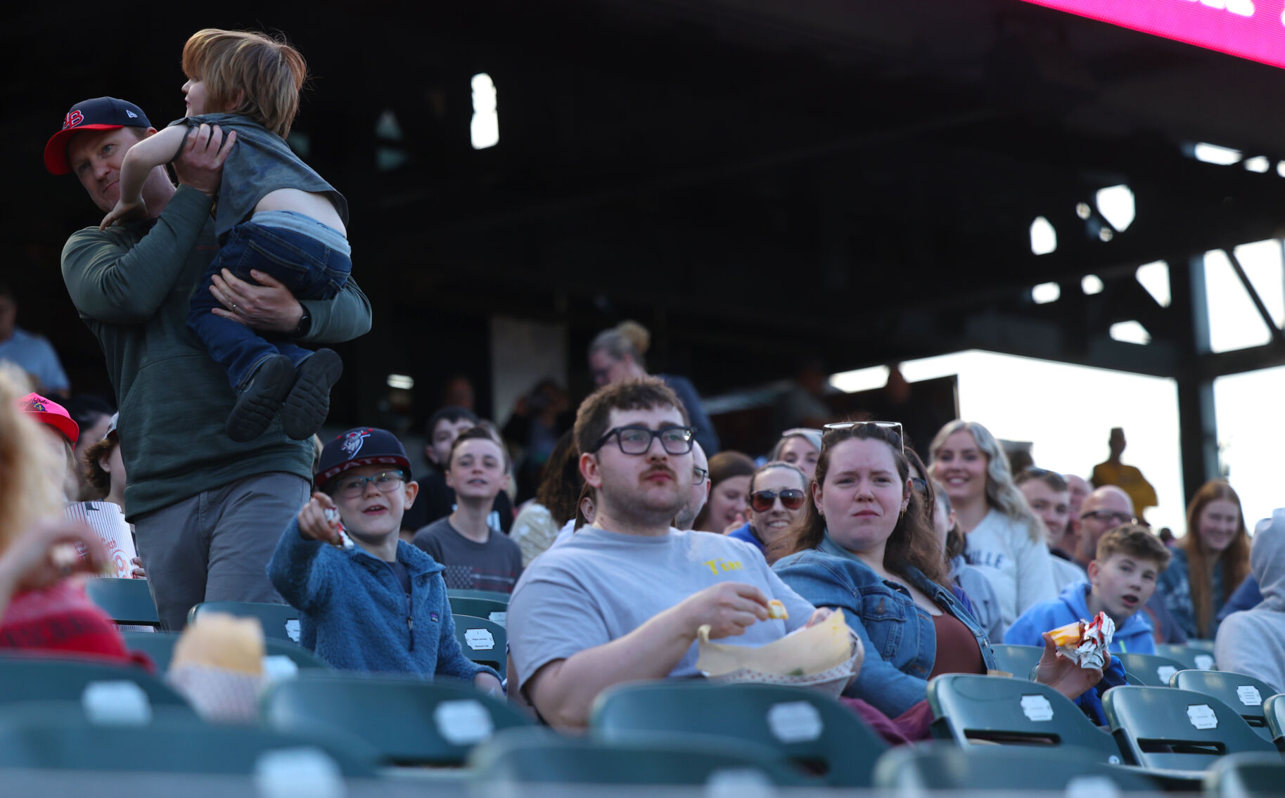 Fans watch Bats game on opening night.JPG