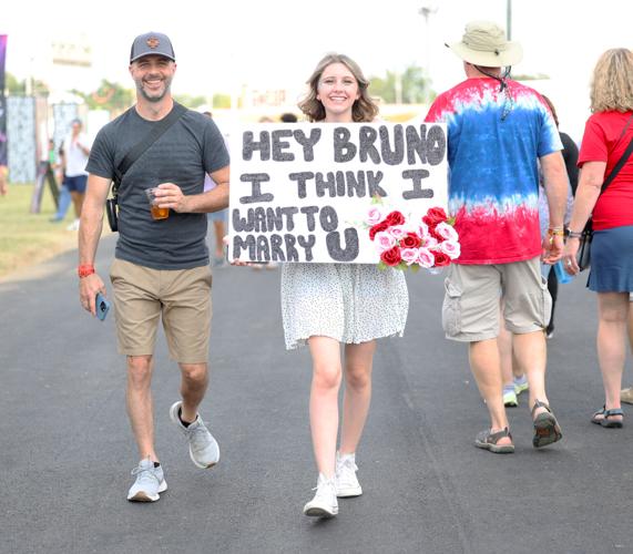 Girl carries Bruno Mars sign at Bourbon and Beyond.JPG