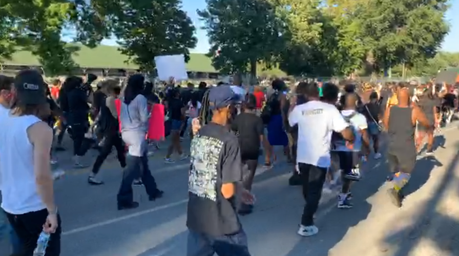Louisville protesters march around Churchill Downs on Derby day