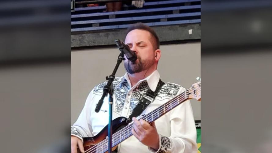 Jamie Via sings and plays guitar