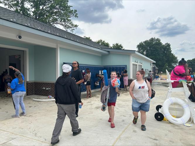 People walk by Algonquin Park Pool - May 25, 2025.jpeg