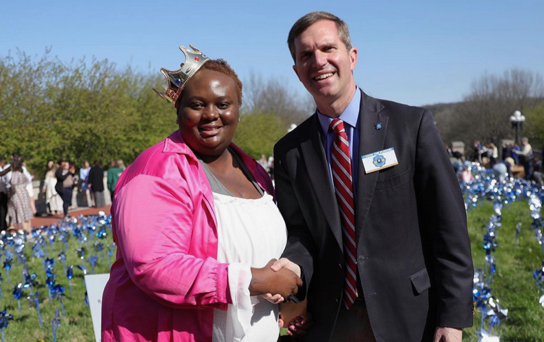 Marie-Ange Mbumba with Andy Beshear