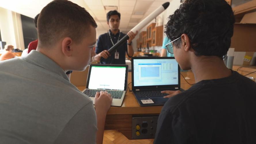 Students at Louisville Rocketry examine rocket performance and engineering data