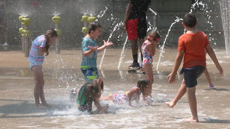Children at downtown Louisville splash park during heat wave on July 26, 2023