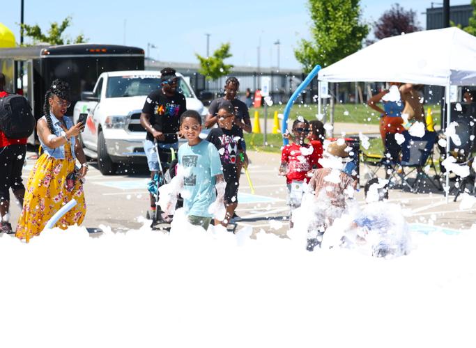 Children play in foam at Louisville Juneteenth Festival.JPG