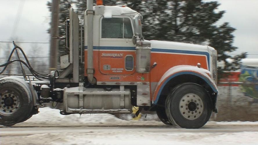 A truck with Suburban Towing, Inc.