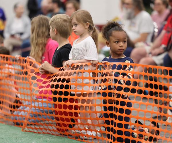 Children hold fencing at Bluegrass Pugfest