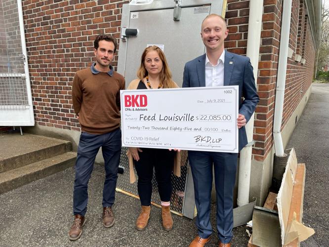 BKD Awarding Check to Feed Louisville