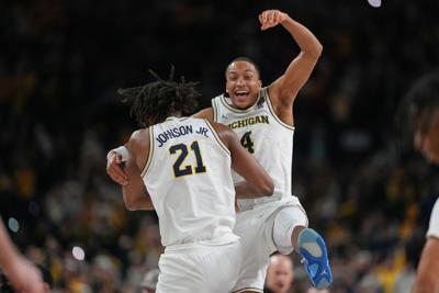 APTOPIX NCAA UConn Michigan Basketball