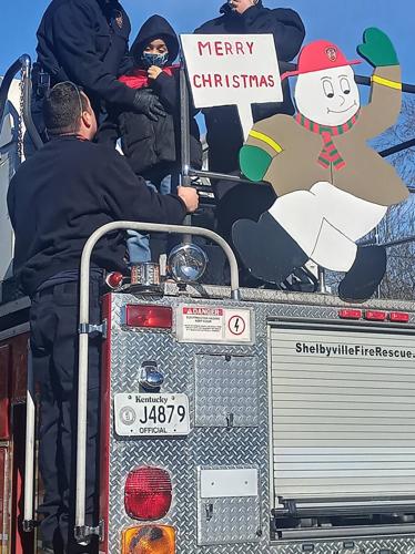 DJ hoisted atop a Shelbyville Fire & Rescue truck (Dec. 2020)