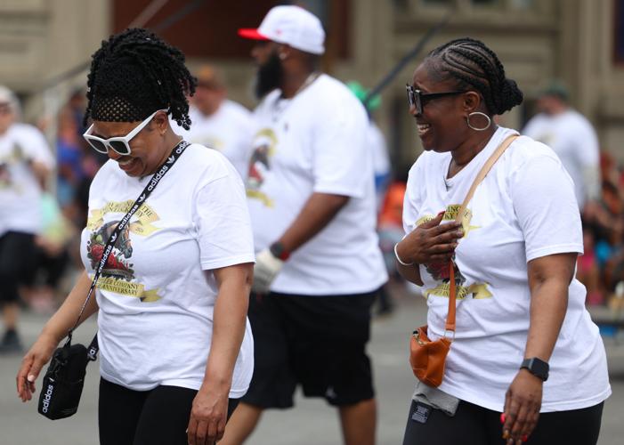 People walk in the Pegasus parade.JPG