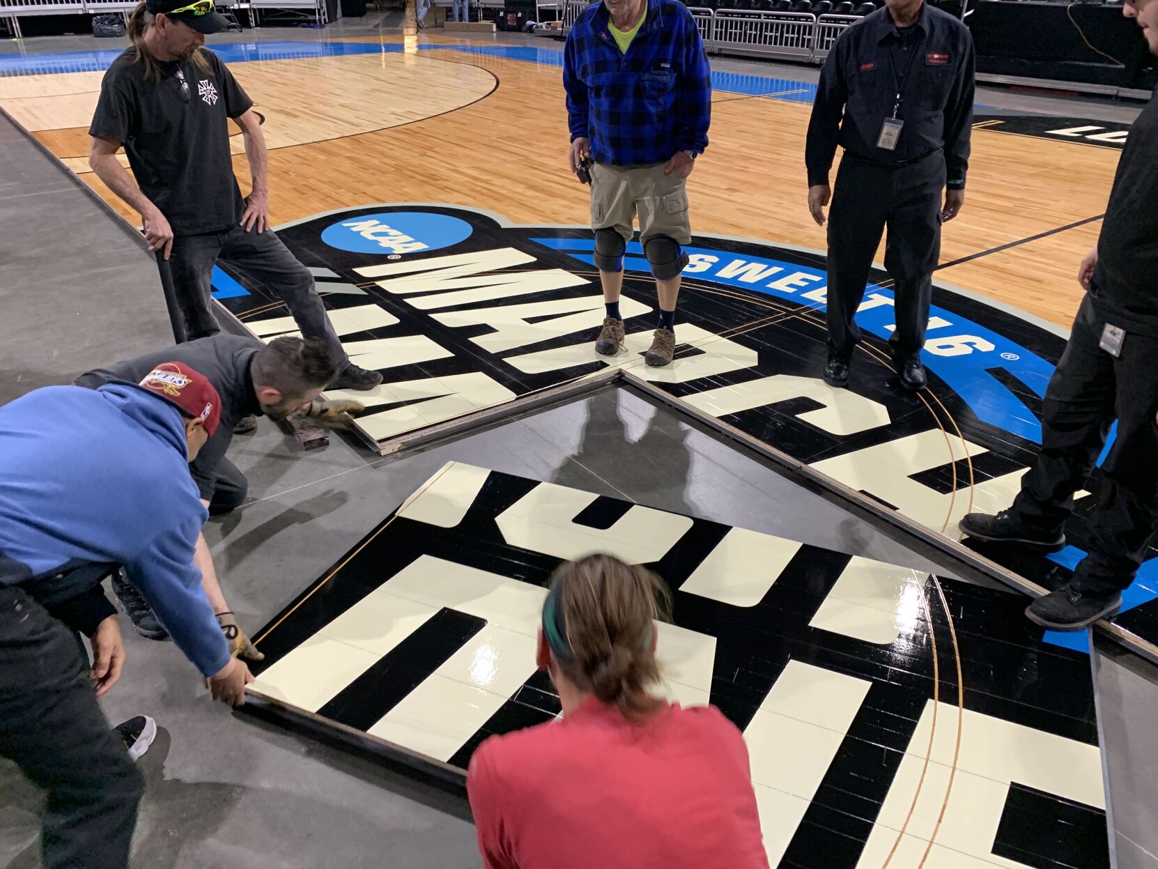 NCAA FLOOR  BEING INSTALLED AT YUM CENTER 3-21-2023 (8).JPG
