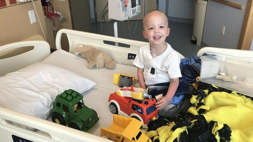 Childhood Cancer - Beckett Burge with toys in hospital