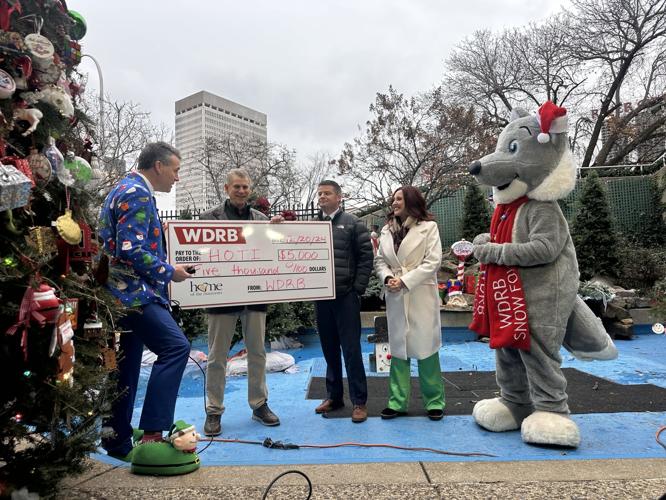WDRB Media presents donation check to Jude's Jingle Tree