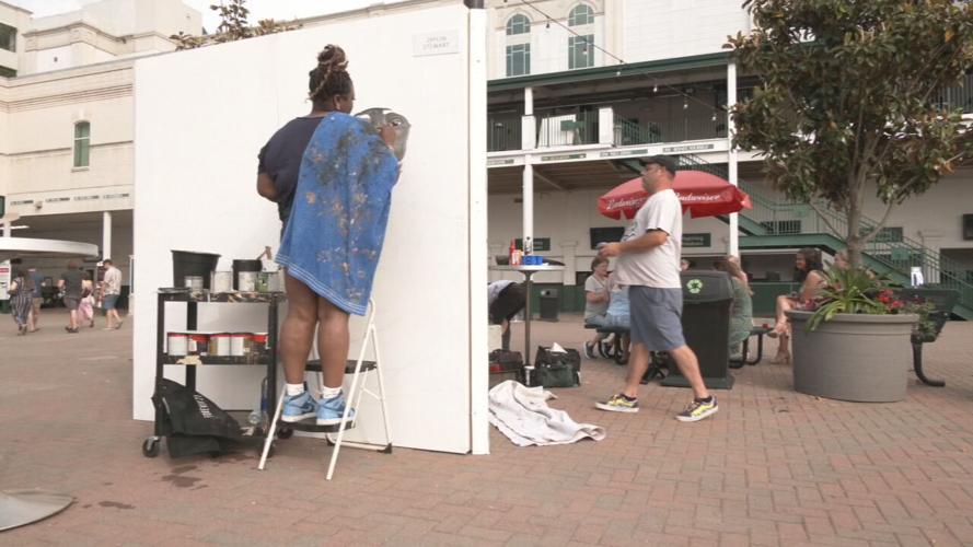 DOWNS AFTER DARK artist paints mural.jpeg