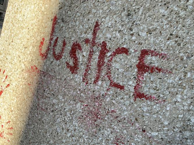 Red paint spells out "justice" outside Louisville's Hall of Justice 5-29-20