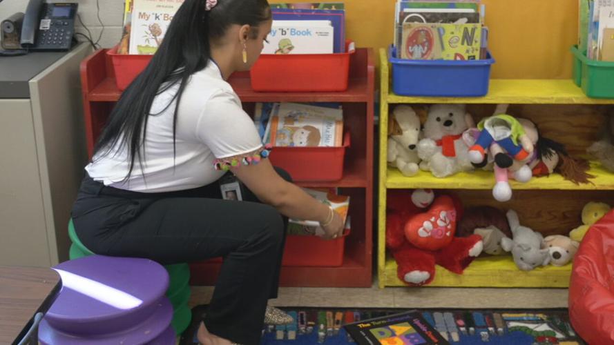 King Elementary staffer straightens school materials