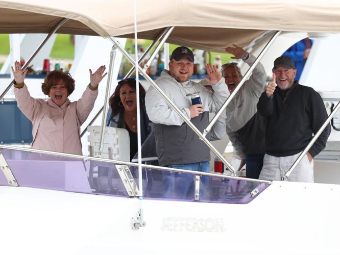 Boaters wave to camera.JPG