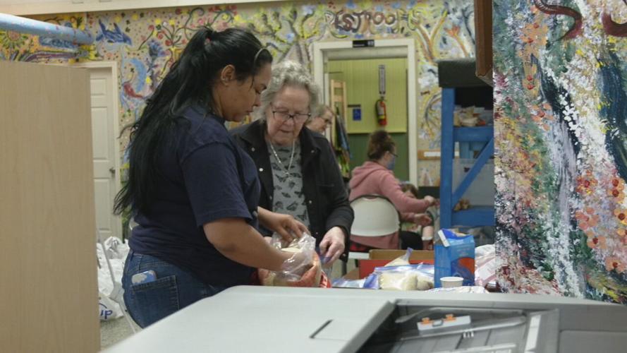 Volunteers assemble food bags, hygiene kits at La Casita Center 4-7-23