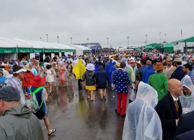 Big crowds brave several inches of rain for 144th Kentucky Derby