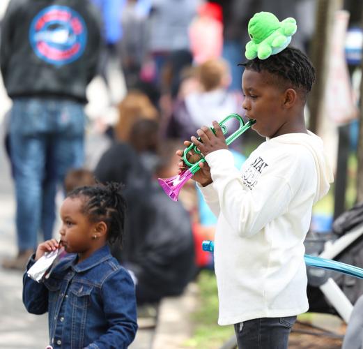 Boy plays trump at parade.JPG